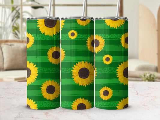 Green striped tumbler with sunflowers and a straw.
