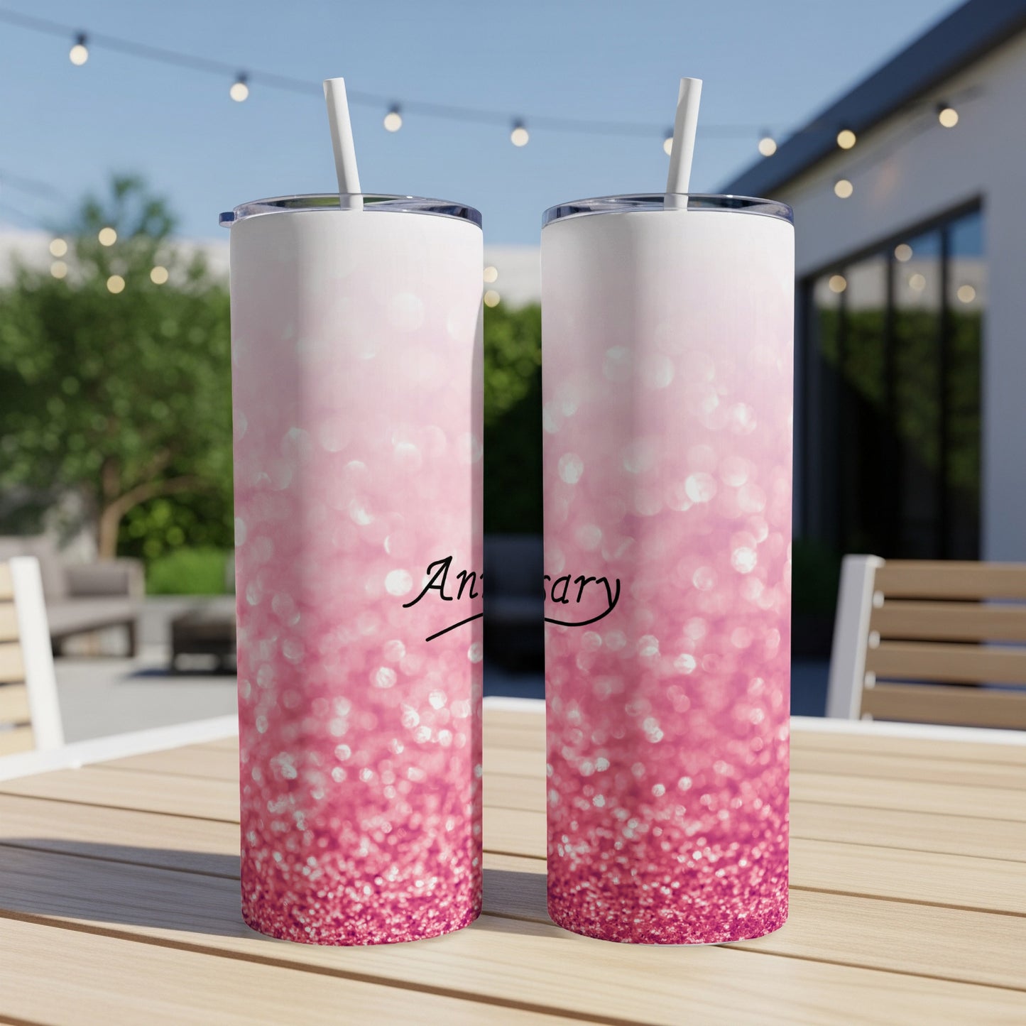 Two tall tumblers with pink glitter ombre design and "Anniversary" text.