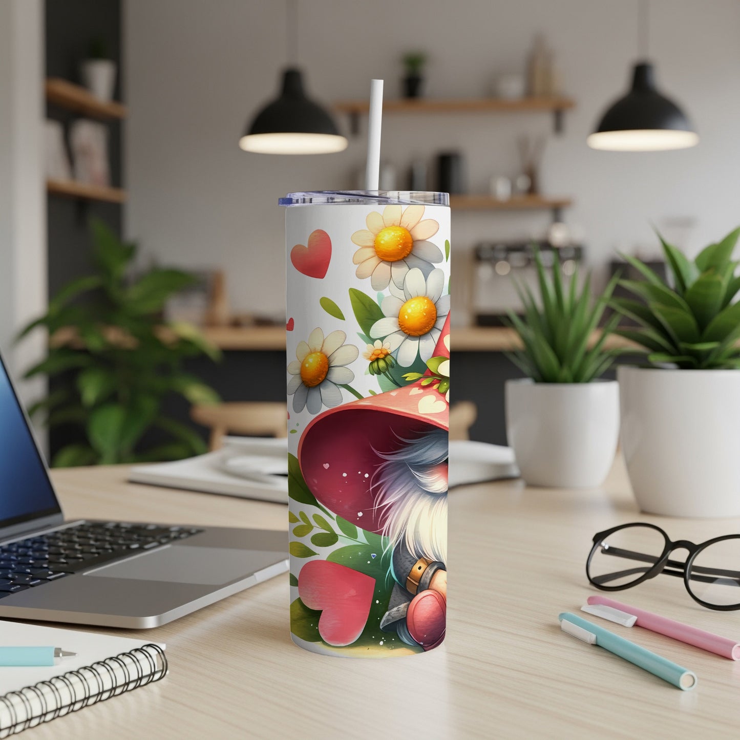 Gnome with hearts and flowers on a white tumbler, with a straw.