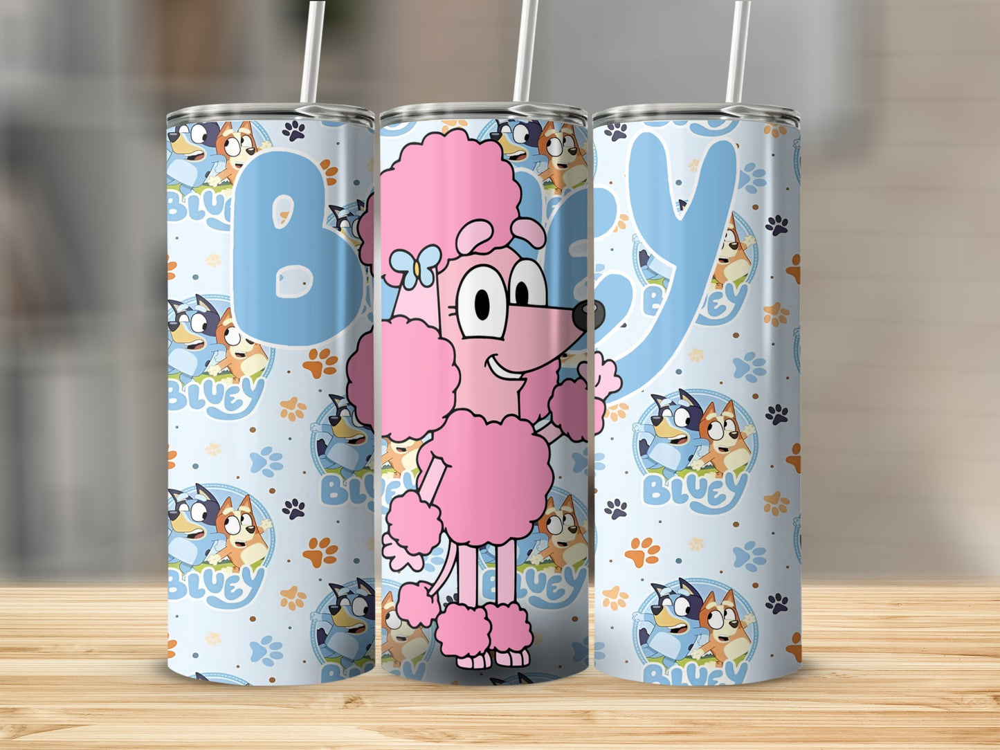 Pink poodle and Bluey characters on a light blue patterned tumbler.