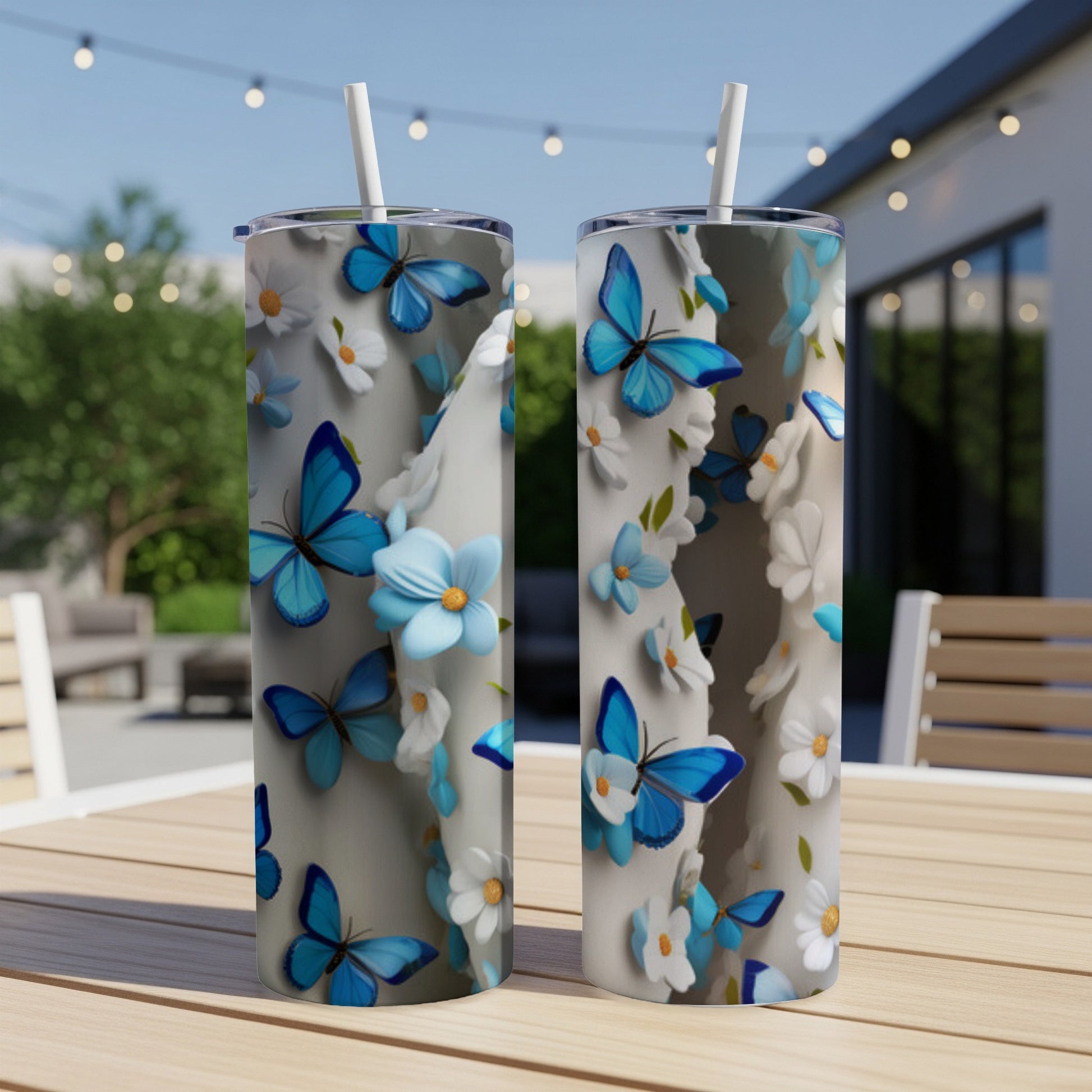 Two tall tumblers with blue butterflies and white flowers pattern.