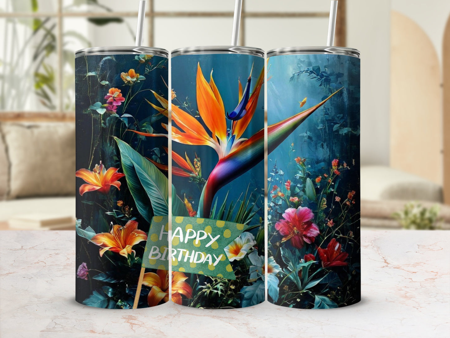 Three tumblers with a tropical bird of paradise and floral design, one says "Happy Birthday".