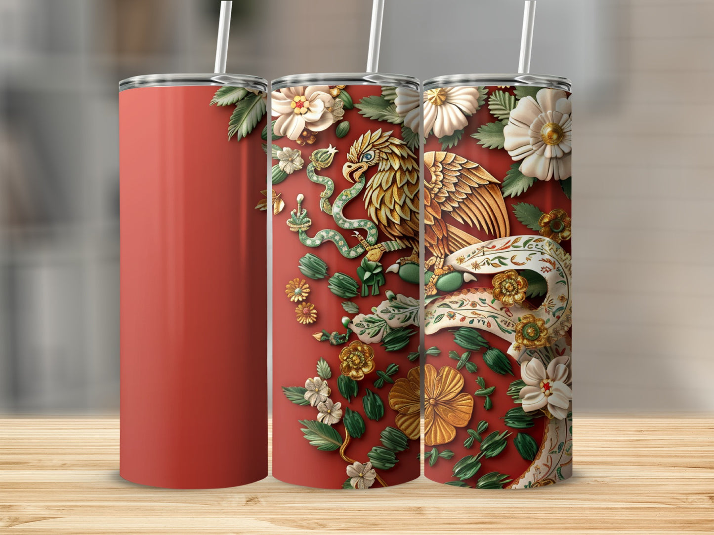 Red tumbler with ornate gold eagle and floral design.
