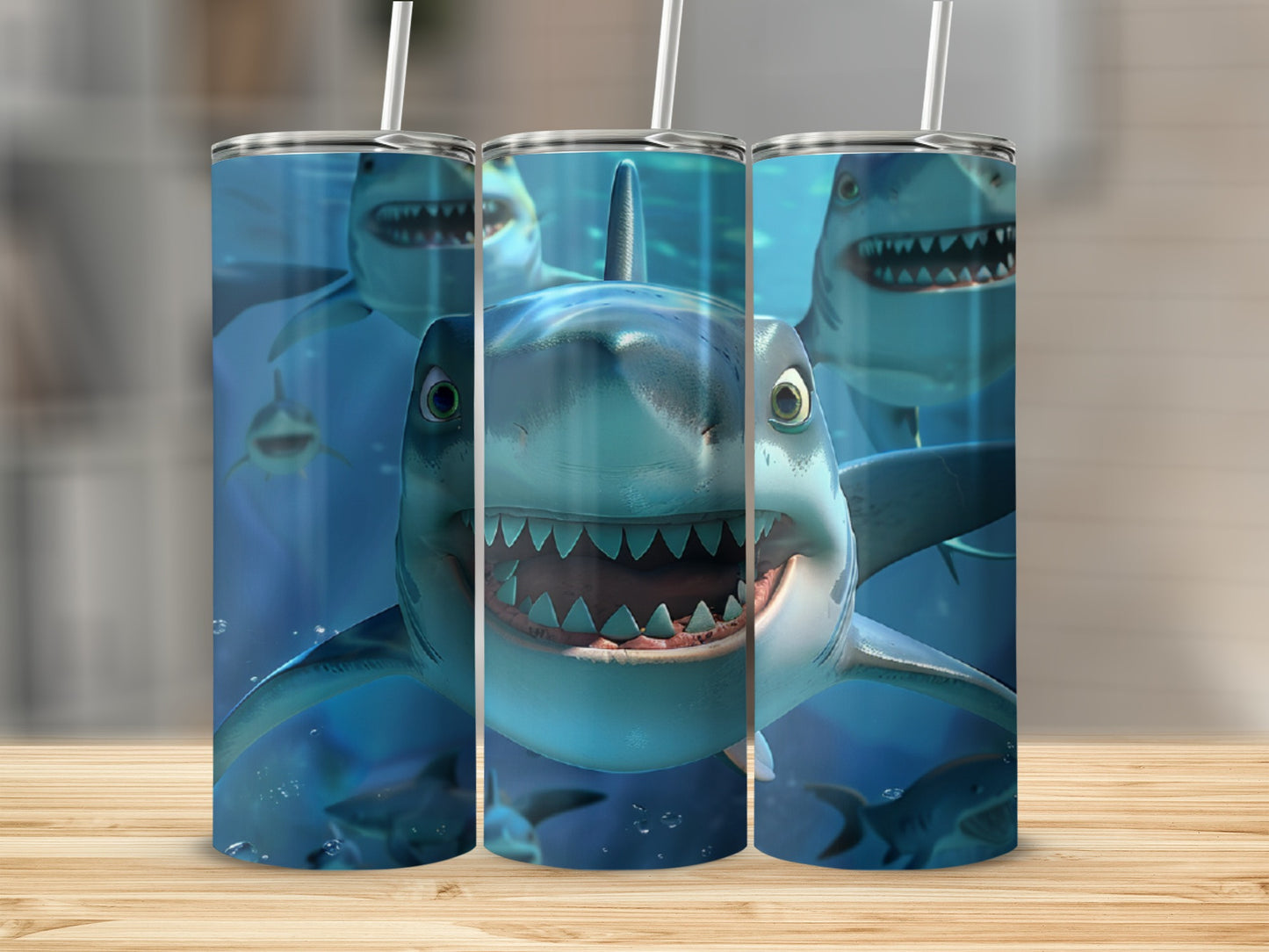 Three cartoon sharks with open mouths and sharp teeth on a tumbler.