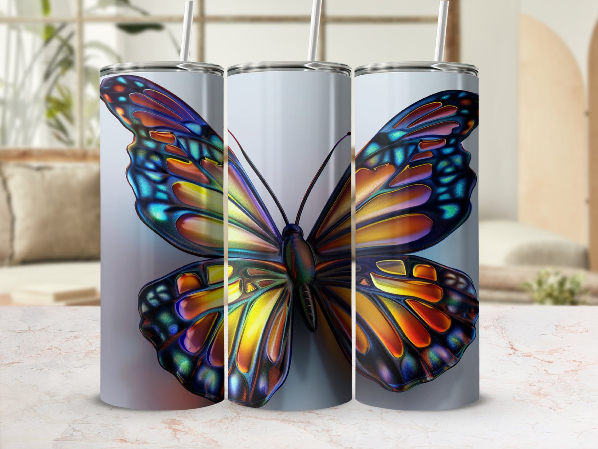 Tall tumbler with colorful butterfly design and straw.