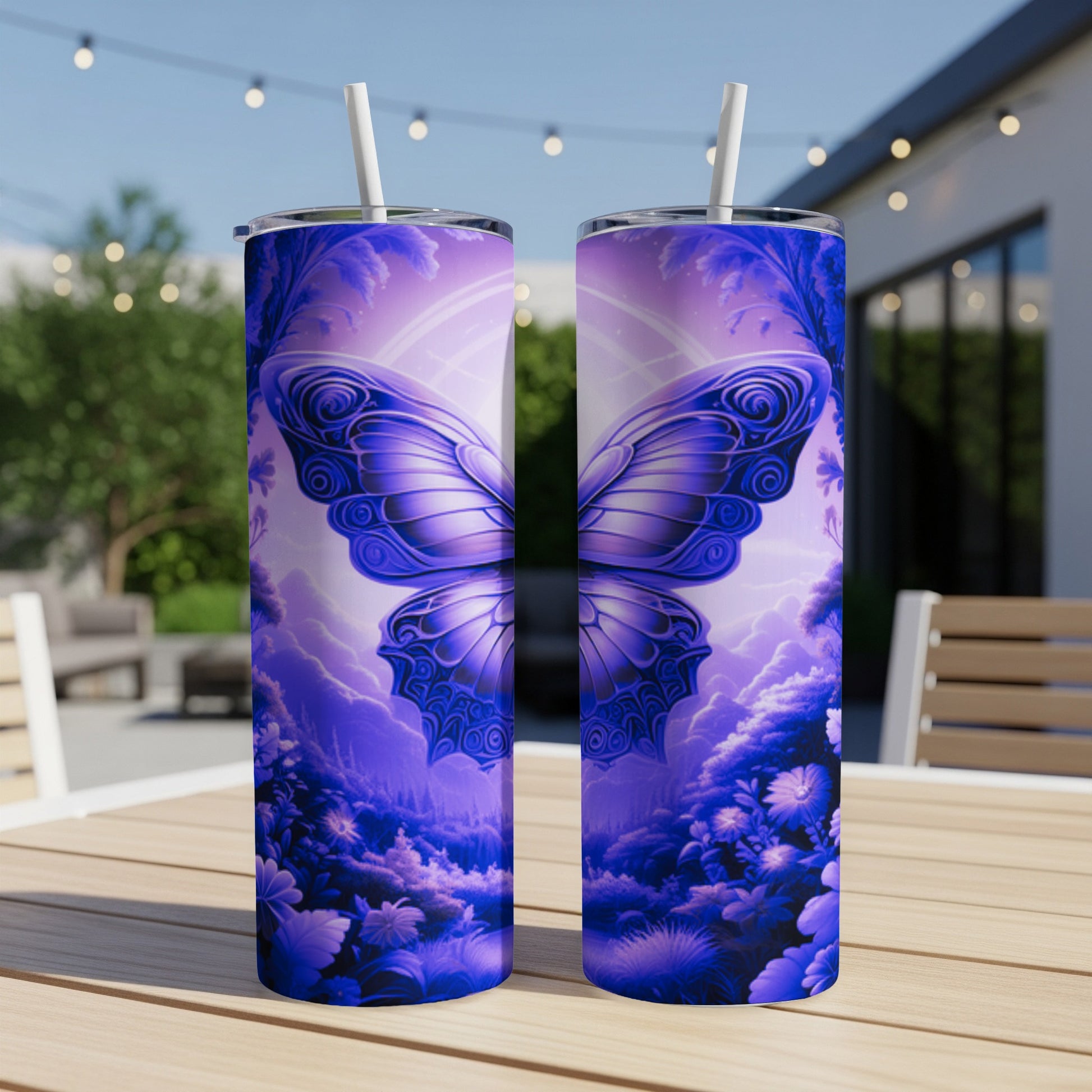 Two tall purple tumblers with butterfly and floral design on a table.