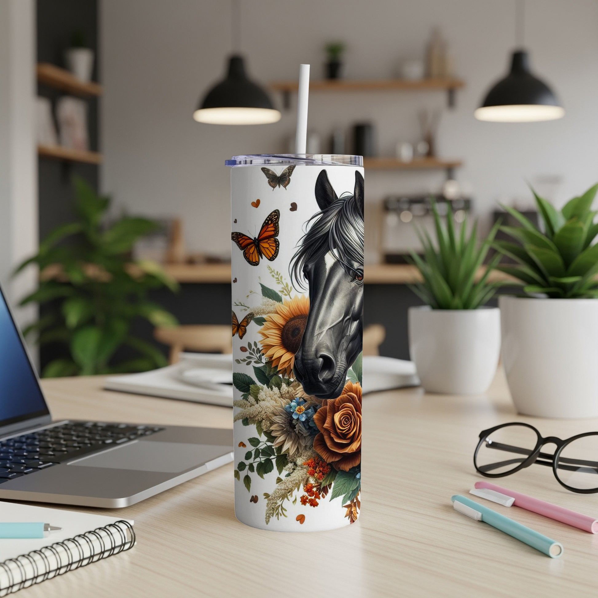 Horse head with floral and butterfly design on a white tumbler.
