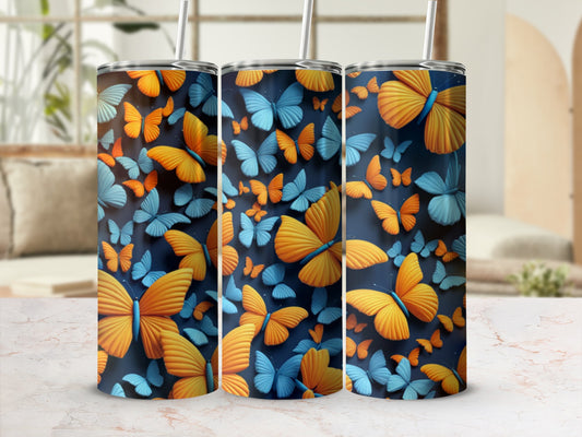 Three tumblers decorated with a repeating pattern of orange and blue butterflies.