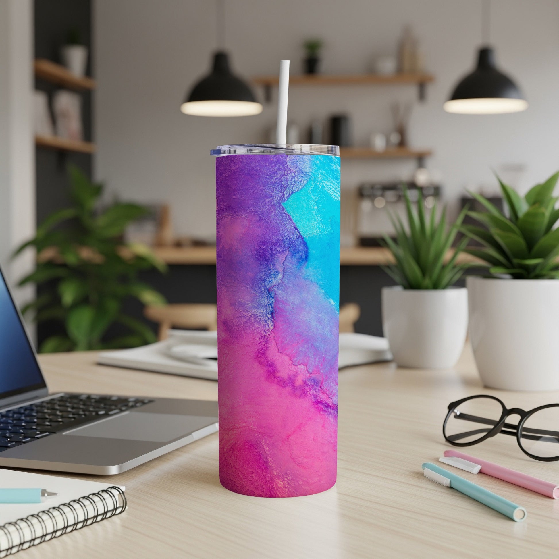 Tumbler with vibrant purple, pink, and blue abstract watercolor design.