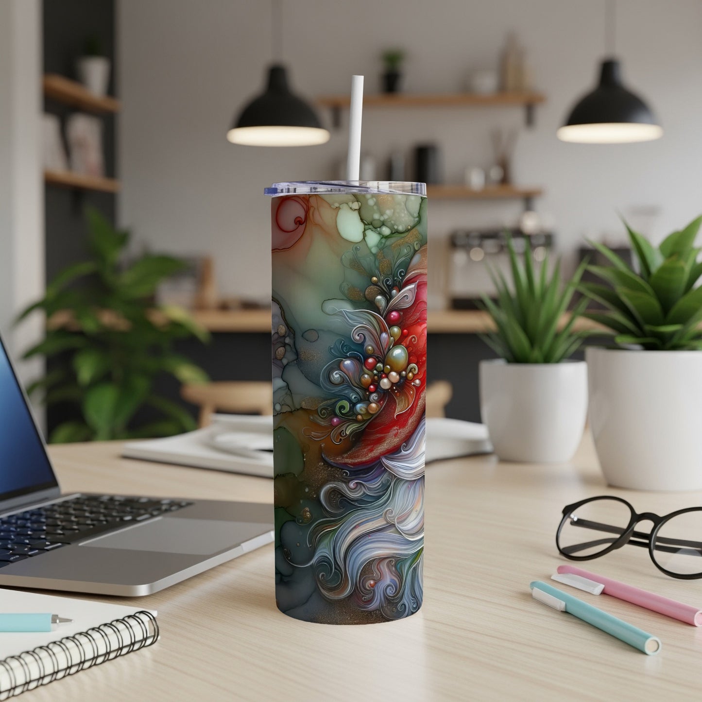 Abstract floral design on a white tumbler with a straw.
