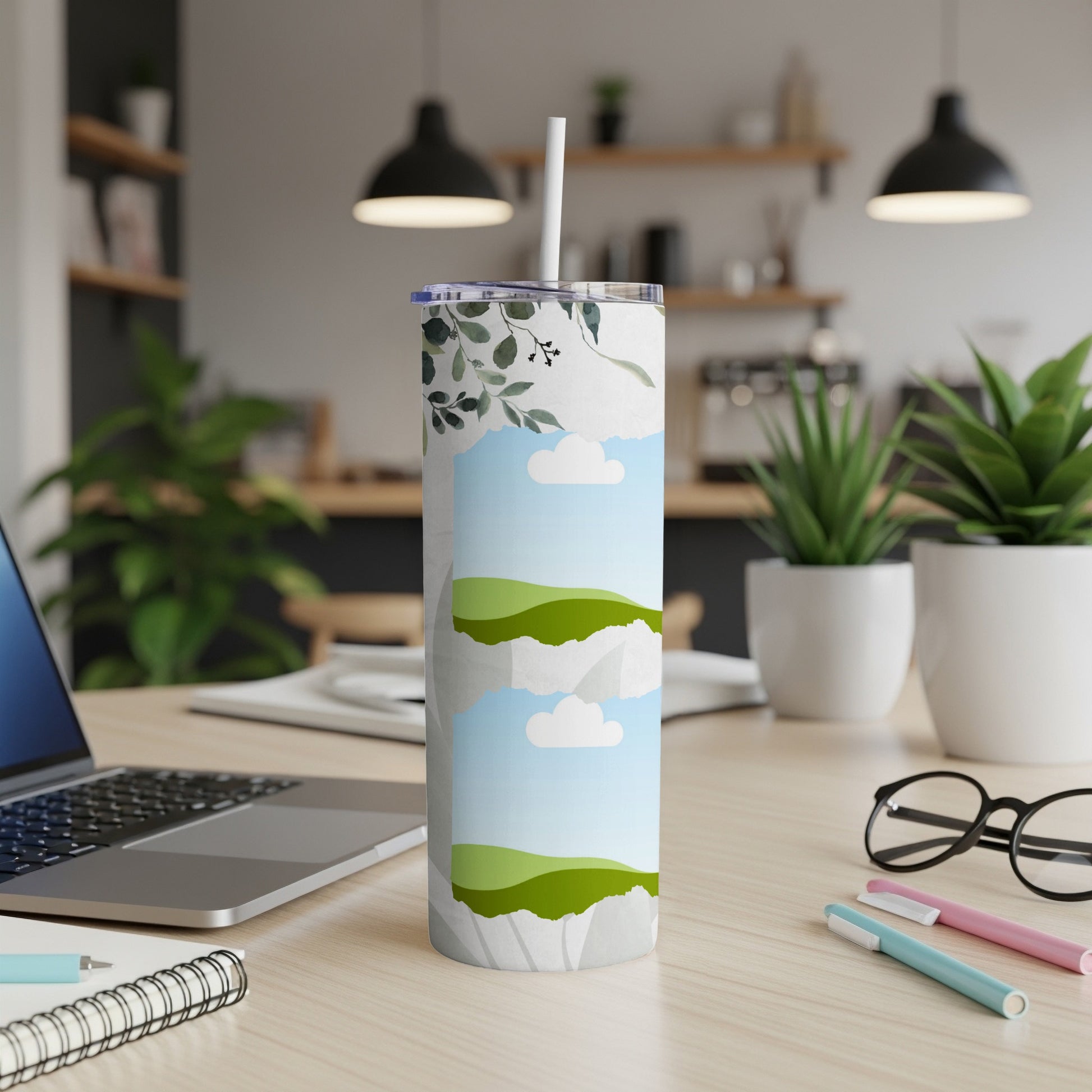 Tumbler with a watercolor landscape and floral design.