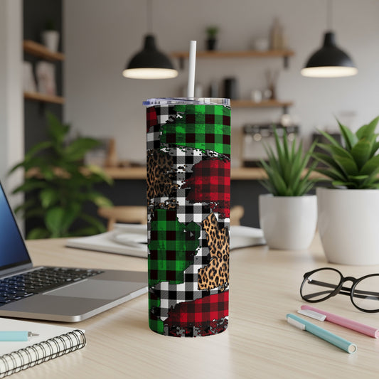 Christmas plaid and leopard print skinny tumbler on desk.