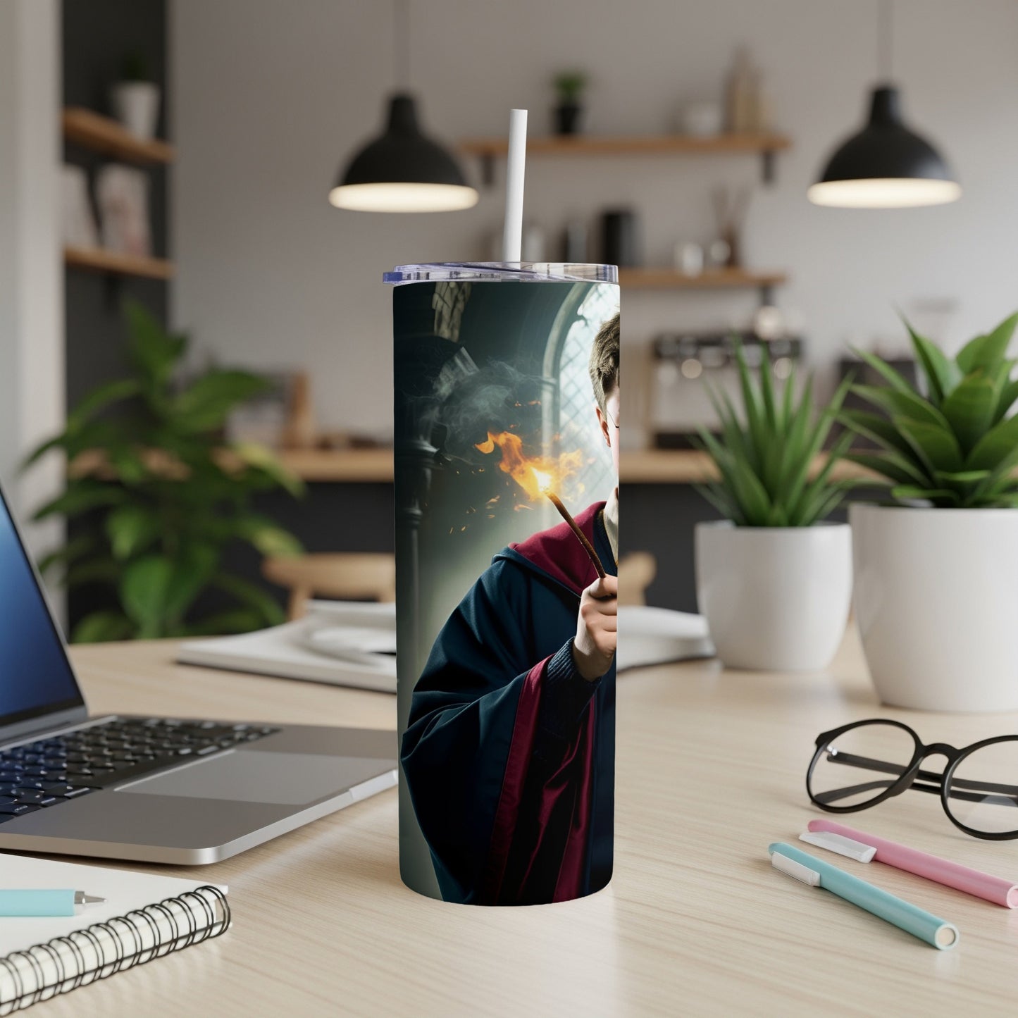 Harry Potter holding a wand with fire, on a tumbler.