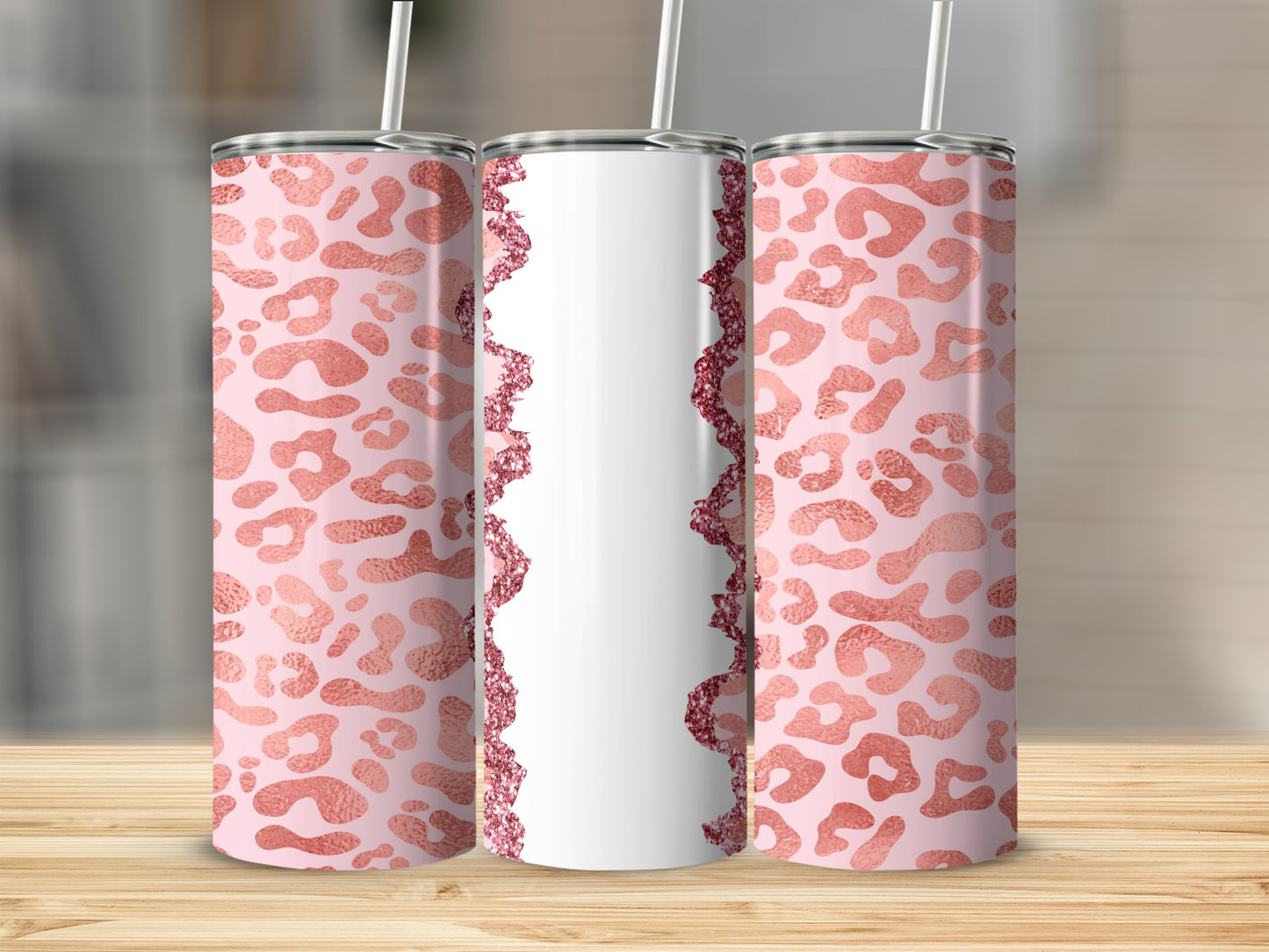 Three pink leopard print tumblers with white and glitter accents.