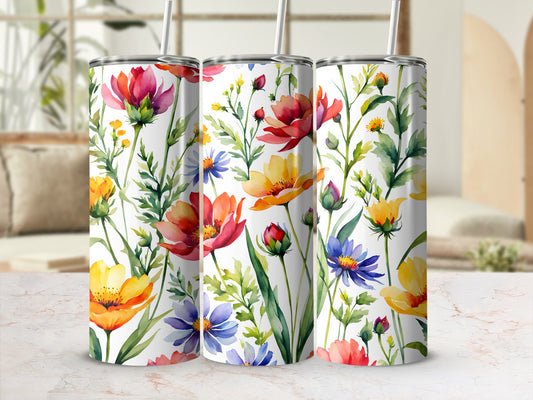 Three tumblers with a watercolor floral pattern of red, yellow, and blue flowers.