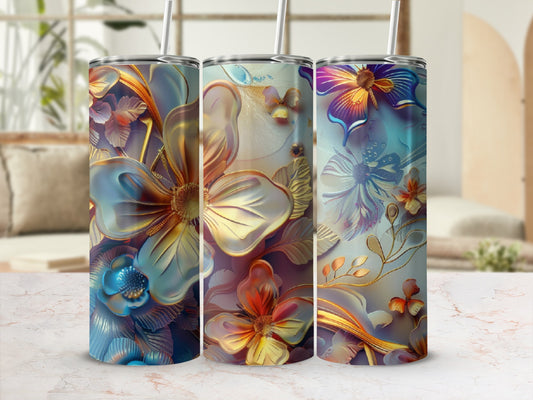 Three tumblers with floral designs in blue, gold, and purple tones.