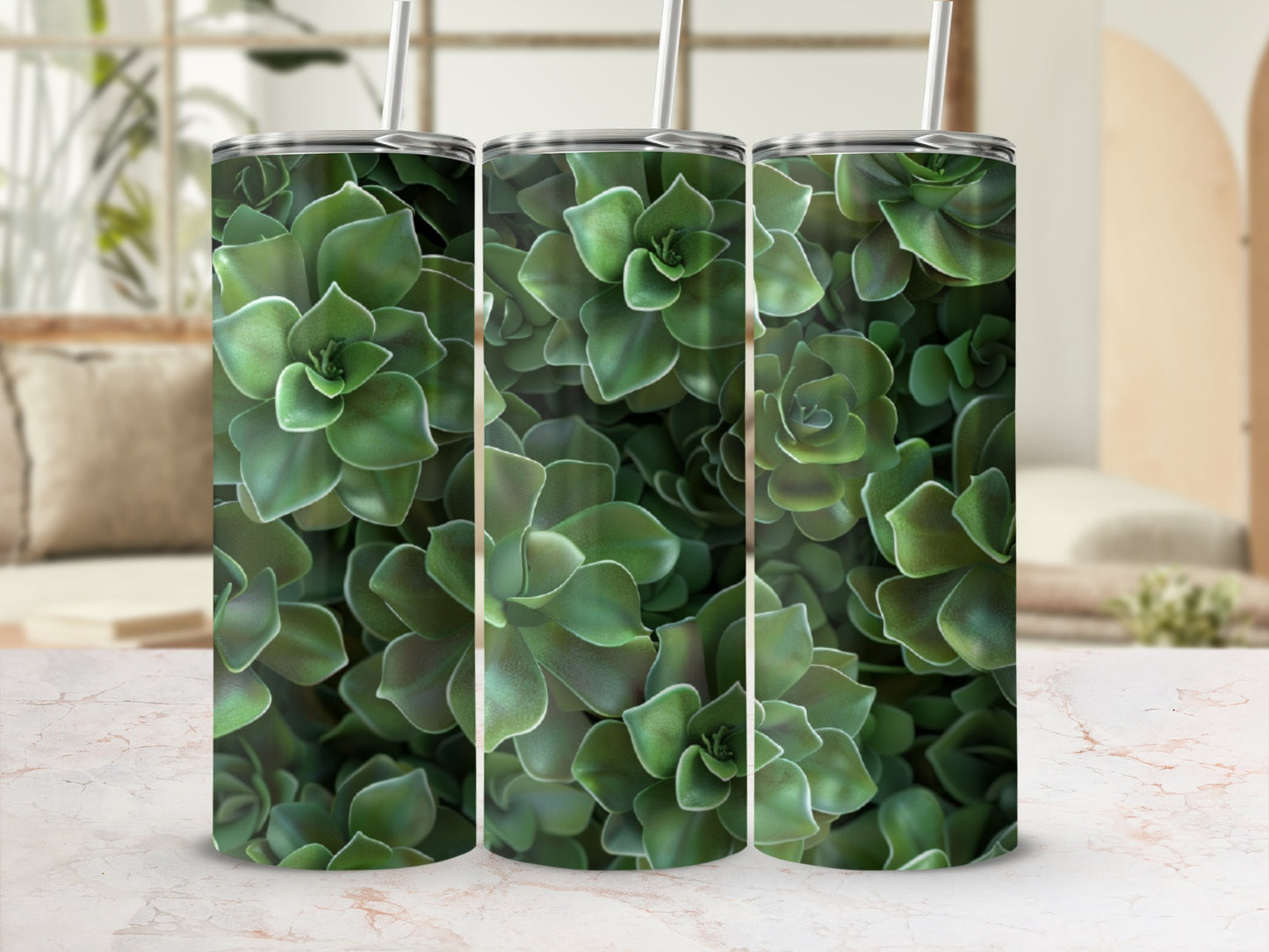 Three tall tumblers with succulent plant pattern, displayed on a marble surface.