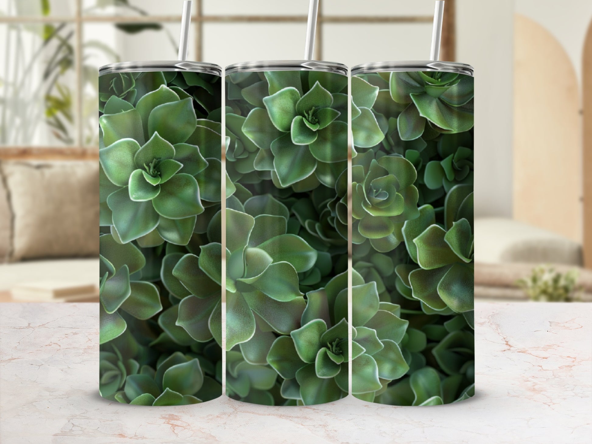 Three tall tumblers with succulent plant pattern, displayed on a marble surface.