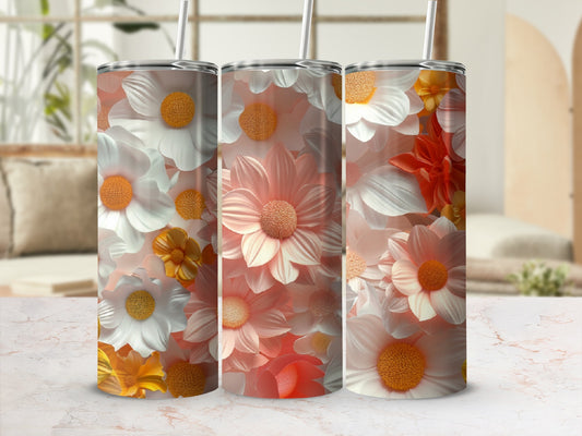 Three tumblers with a floral design of orange and white daisies.