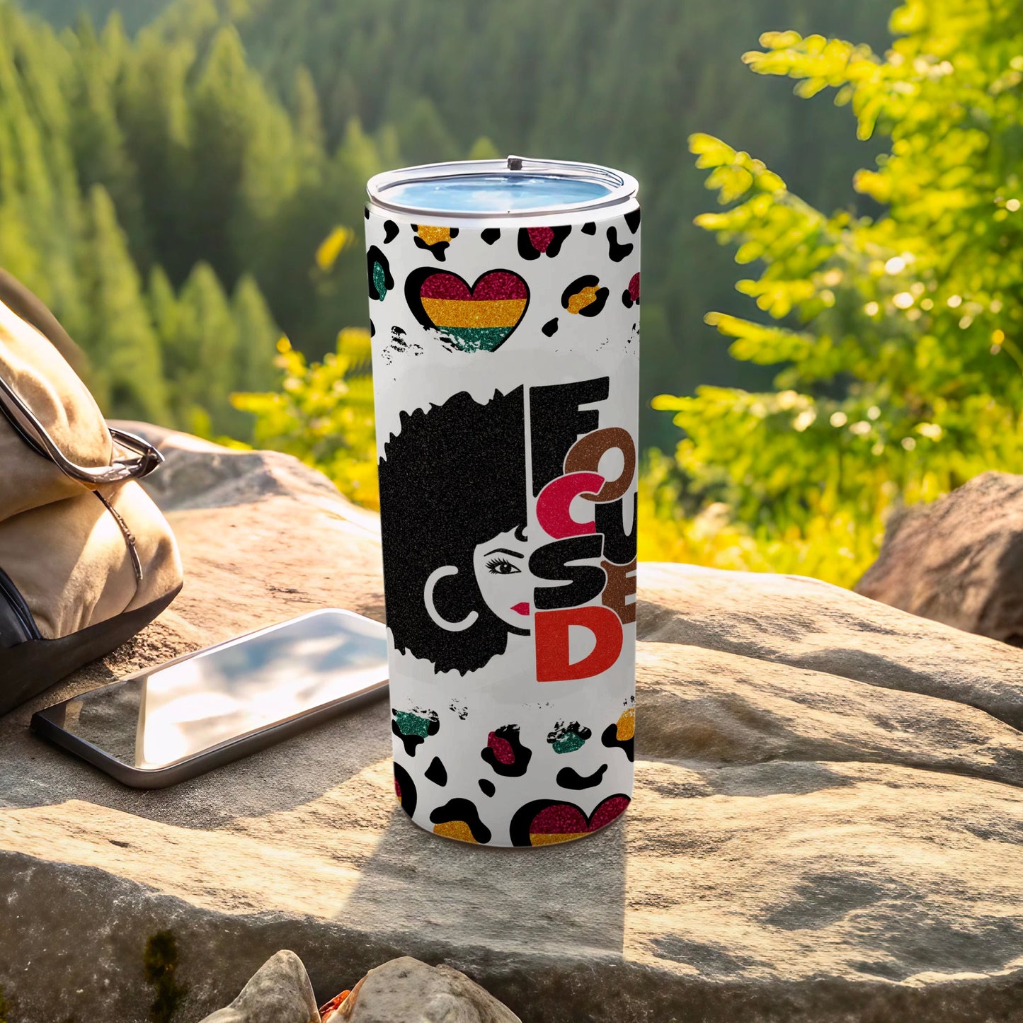 Tumbler with colorful afro art, leopard print, and "Focused" text.