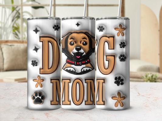 Tumbler with "Dog Mom" text and paw prints, featuring a cartoon dog illustration.