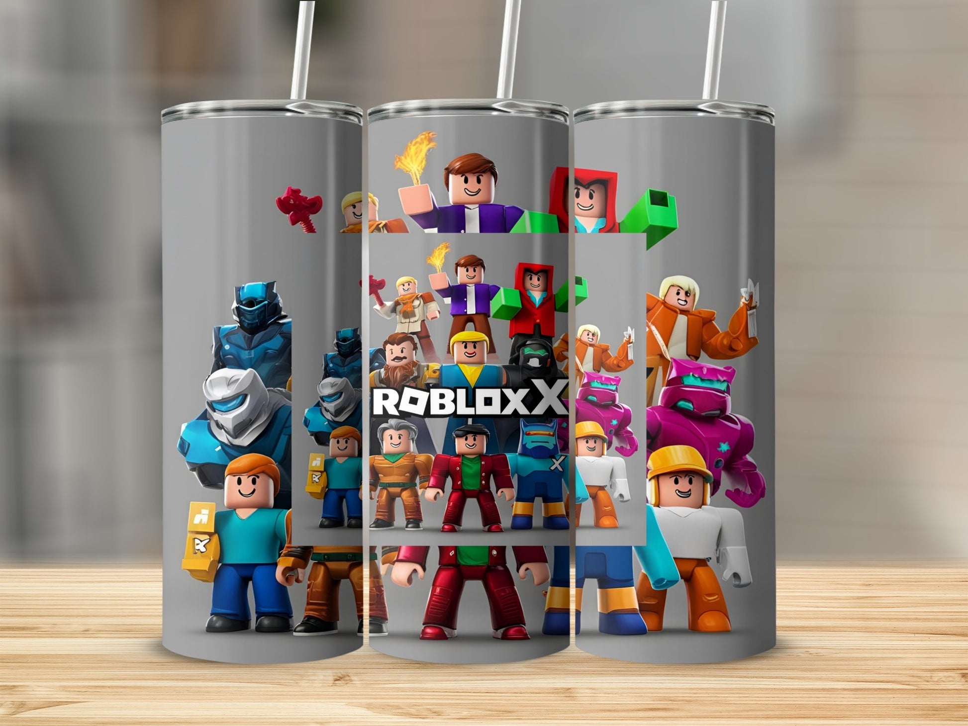 Roblox characters and "ROBLOX" logo on a gray tumbler.