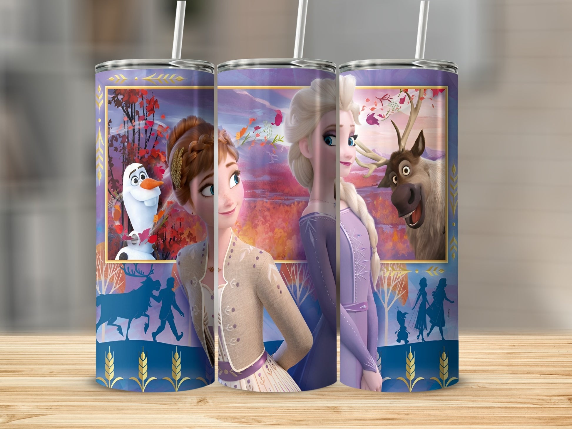 Elsa, Anna, Olaf, and Sven from Frozen on a blue and gold patterned tumbler.