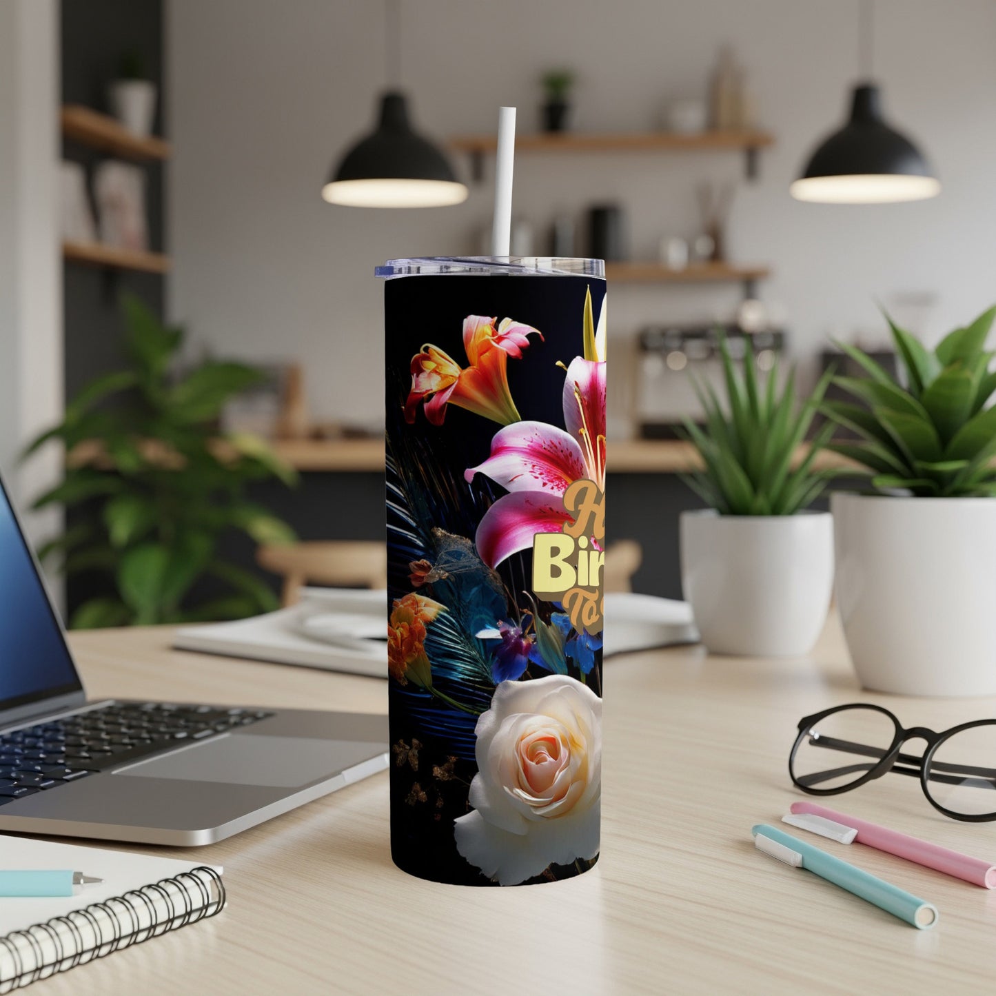 Tall tumbler with floral design and "Happy Birthday" text.