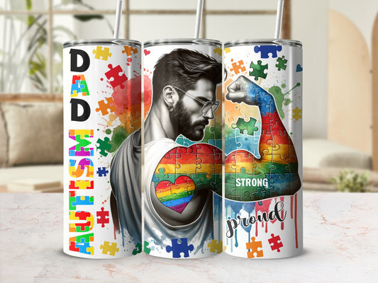 Dad Autism Proud tumbler with puzzle rainbow heart design on muscular arm.