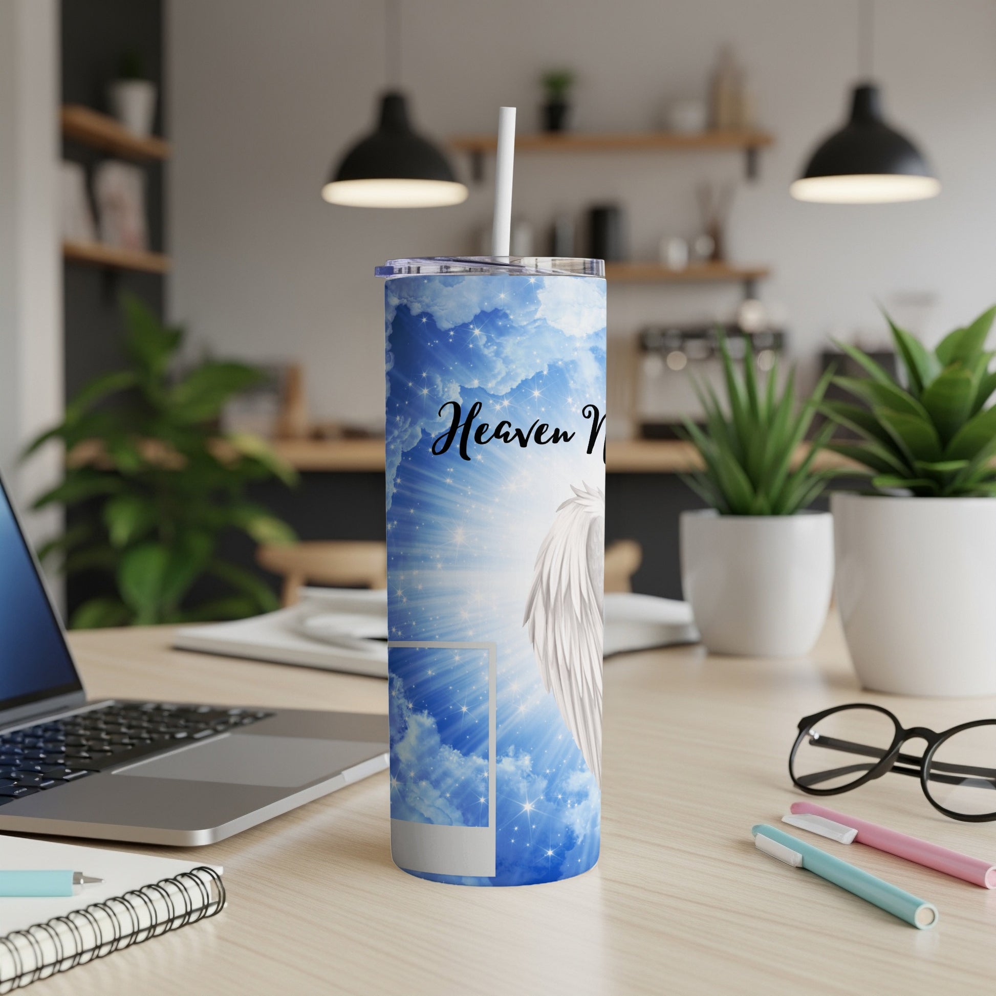 Heaven Vibes tumbler with angel wings and starry sky design.