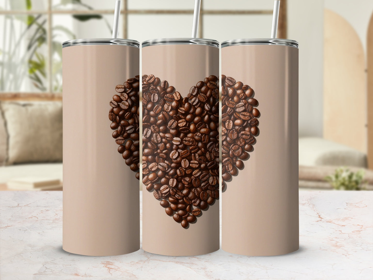 Three tan tumblers with a coffee bean heart design.