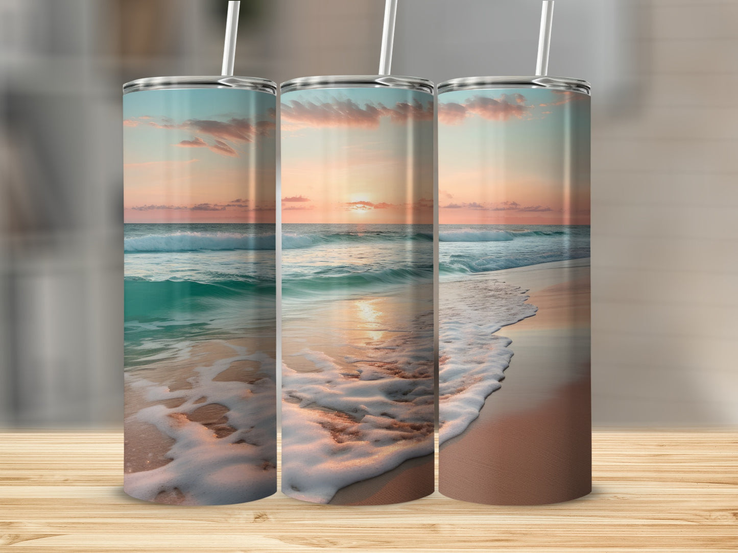 Three tumblers with a sunset beach scene wrap design.
