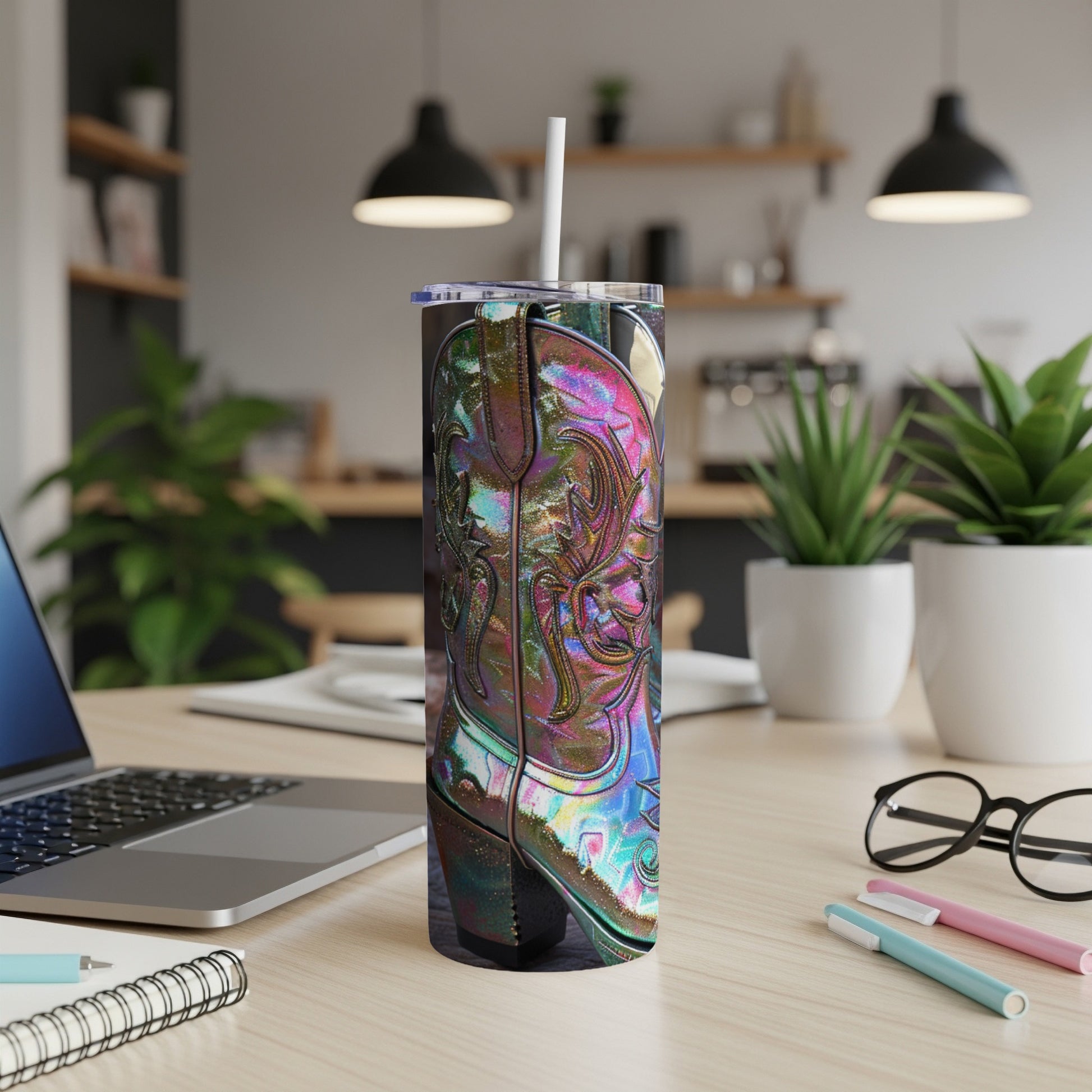 Iridescent cowboy boot design on a stainless steel tumbler with a straw.