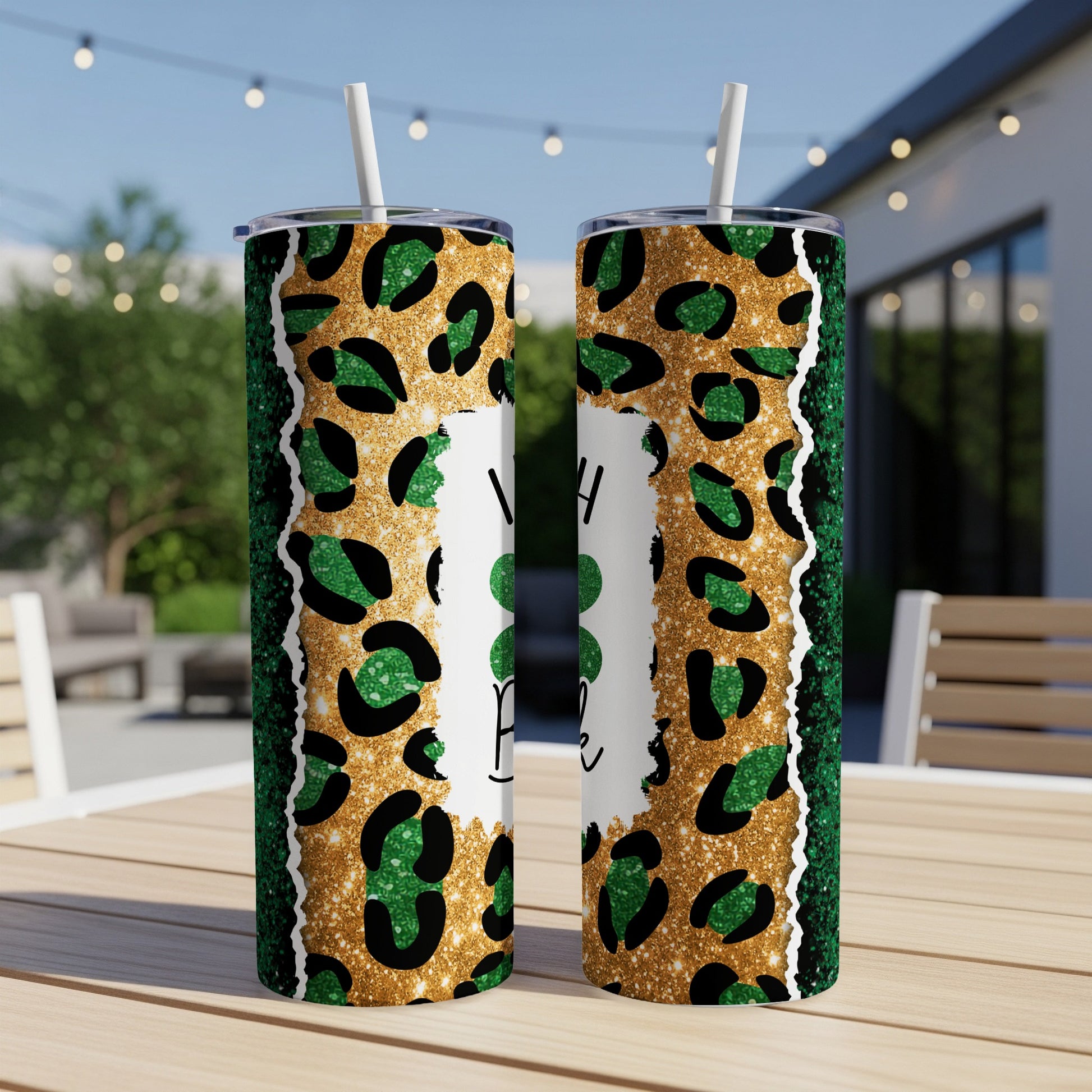 Two tumblers with green leopard print, gold glitter, and "I Need a Little Luck" text.