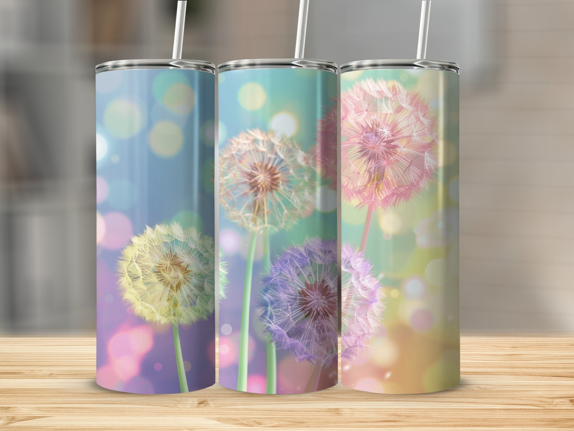 Three tumblers with dandelion designs and bokeh backgrounds.