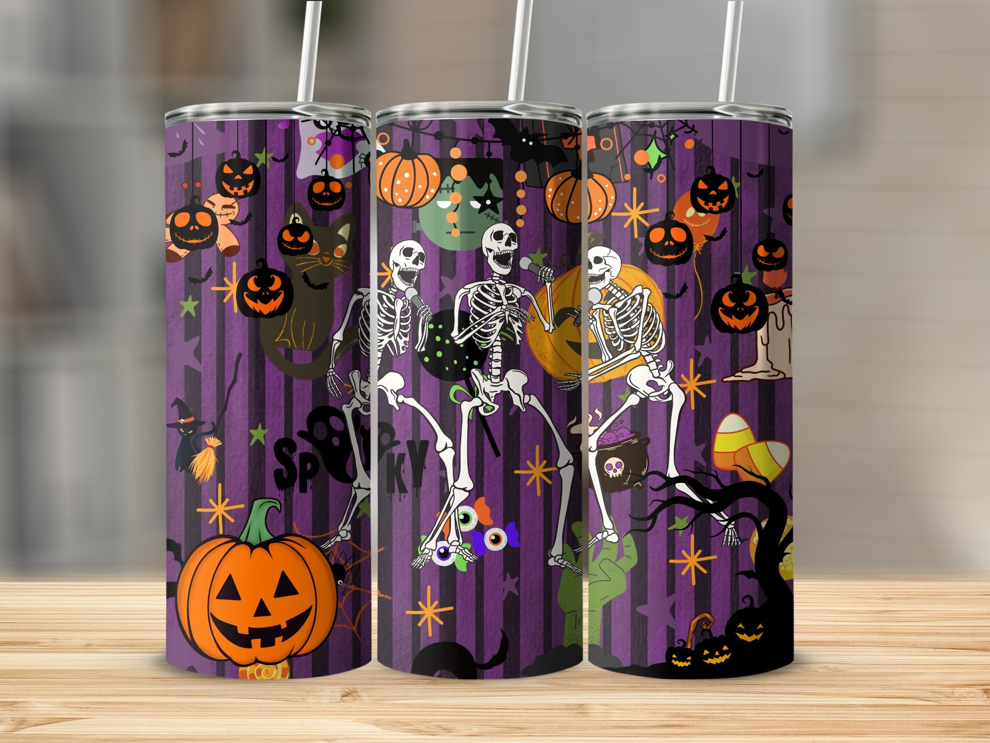 Halloween tumbler with skeletons, pumpkins, black cat, and candy corn.