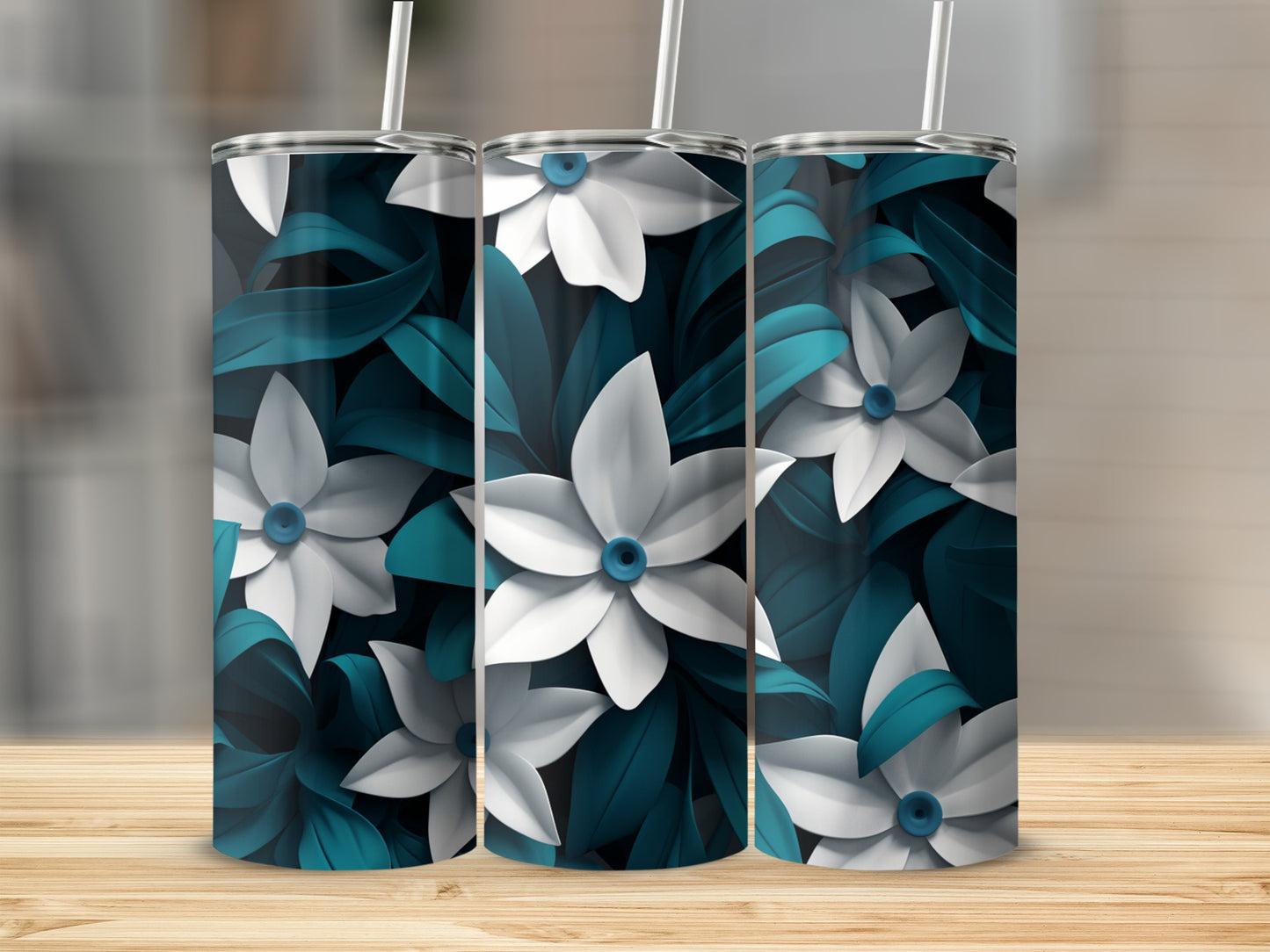 Three tumblers with white and blue floral pattern on a wooden surface.