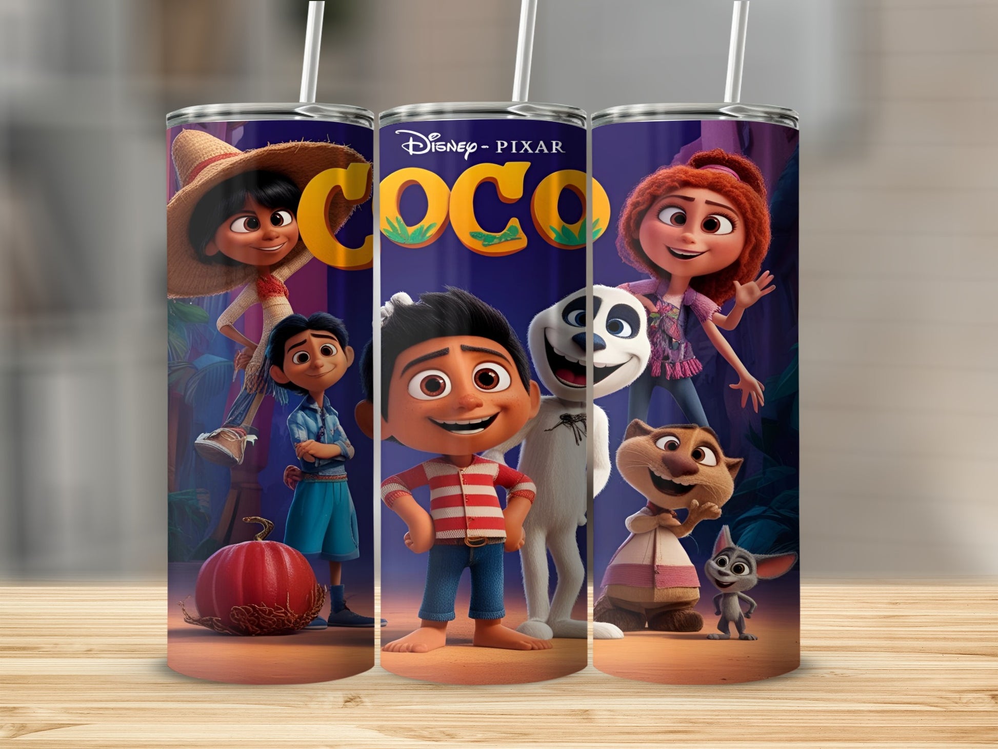 Coco movie characters on a tumbler with a wooden background.