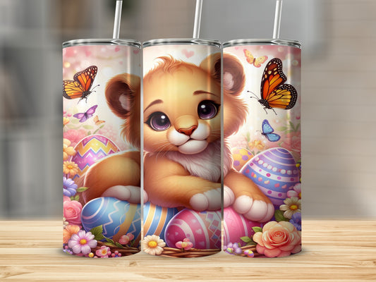 Lion cub surrounded by Easter eggs, flowers, and butterflies.