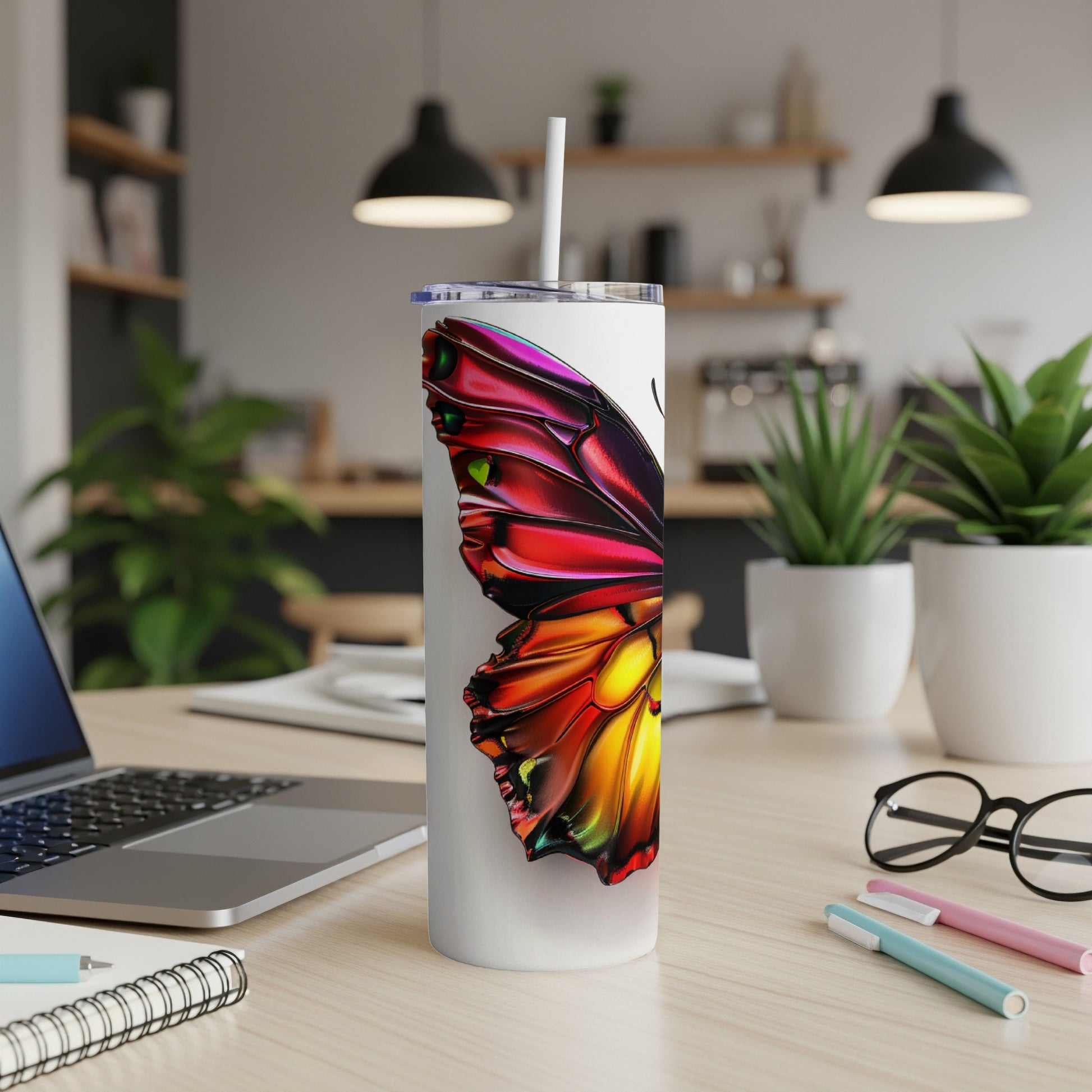 White tumbler with colorful butterfly wing design.