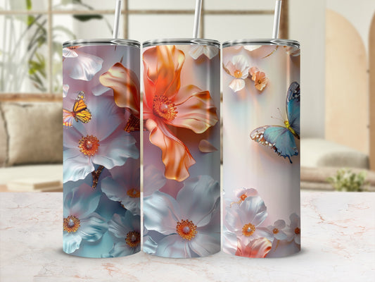 Floral and butterfly design on a trio of white tumblers.