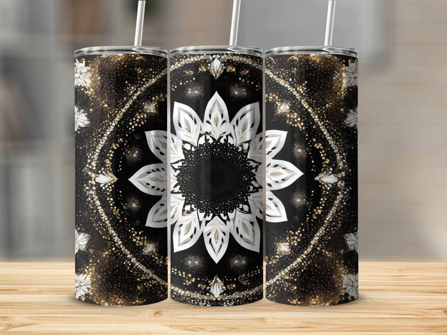 Three tumblers with a black and gold mandala design and a sparkly background.