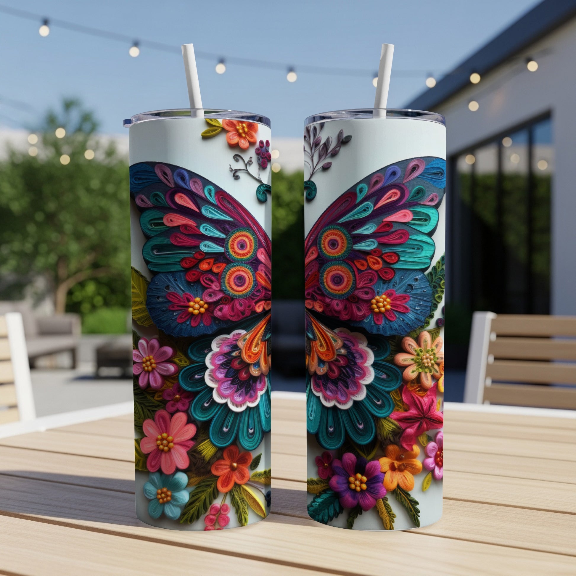 Two tumblers decorated with colorful paper butterfly and floral designs.