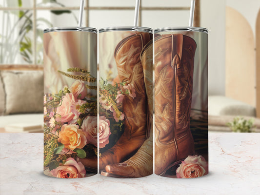 Cowboy boots with flowers, displayed on a marble surface.