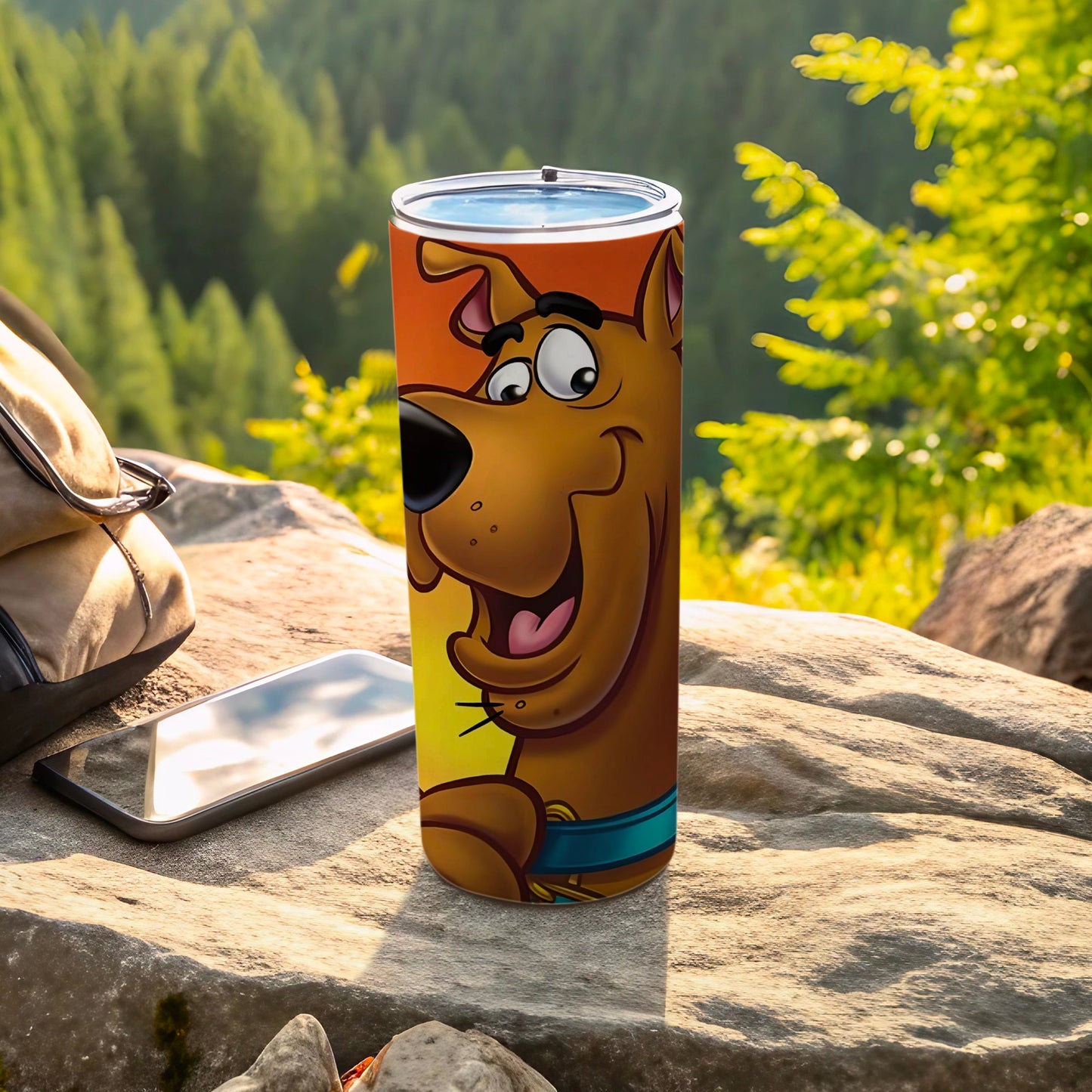 Scooby-Doo character on a cylindrical travel tumbler with a rocky, outdoor background.