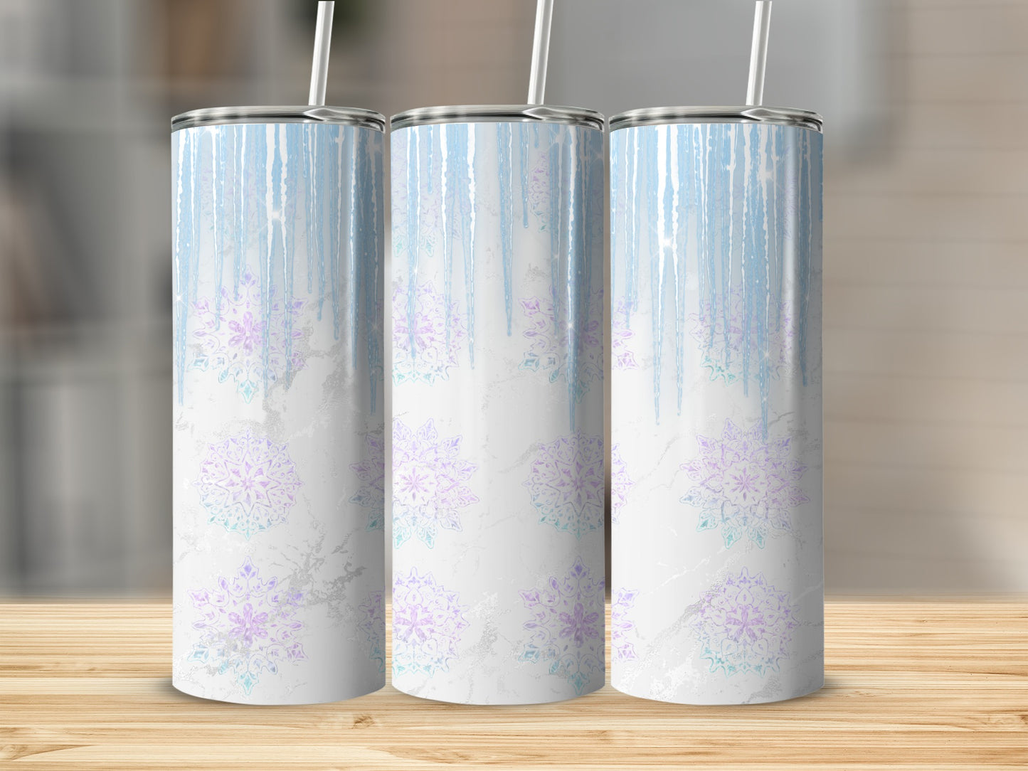 Three white tumblers with pastel blue and purple snowflake design.