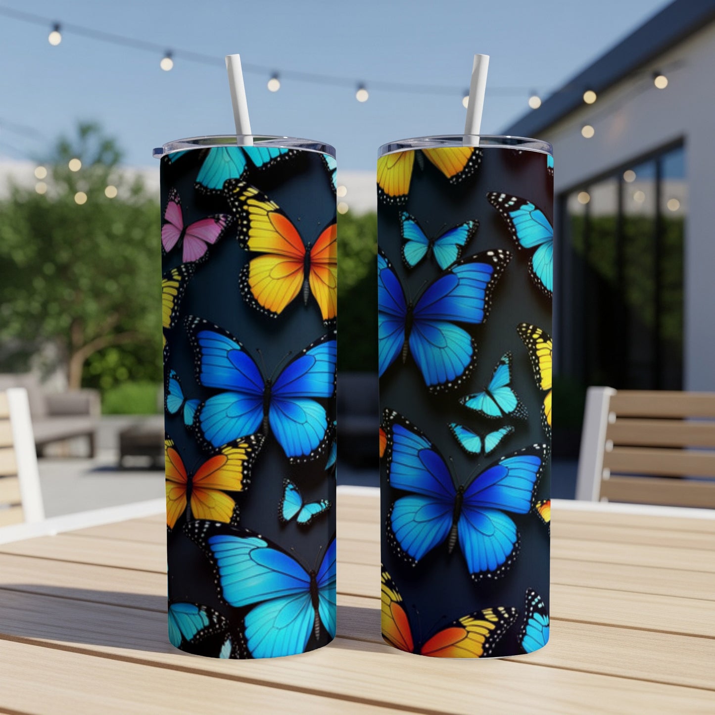 Two tumblers with a colorful butterfly pattern on a dark background.