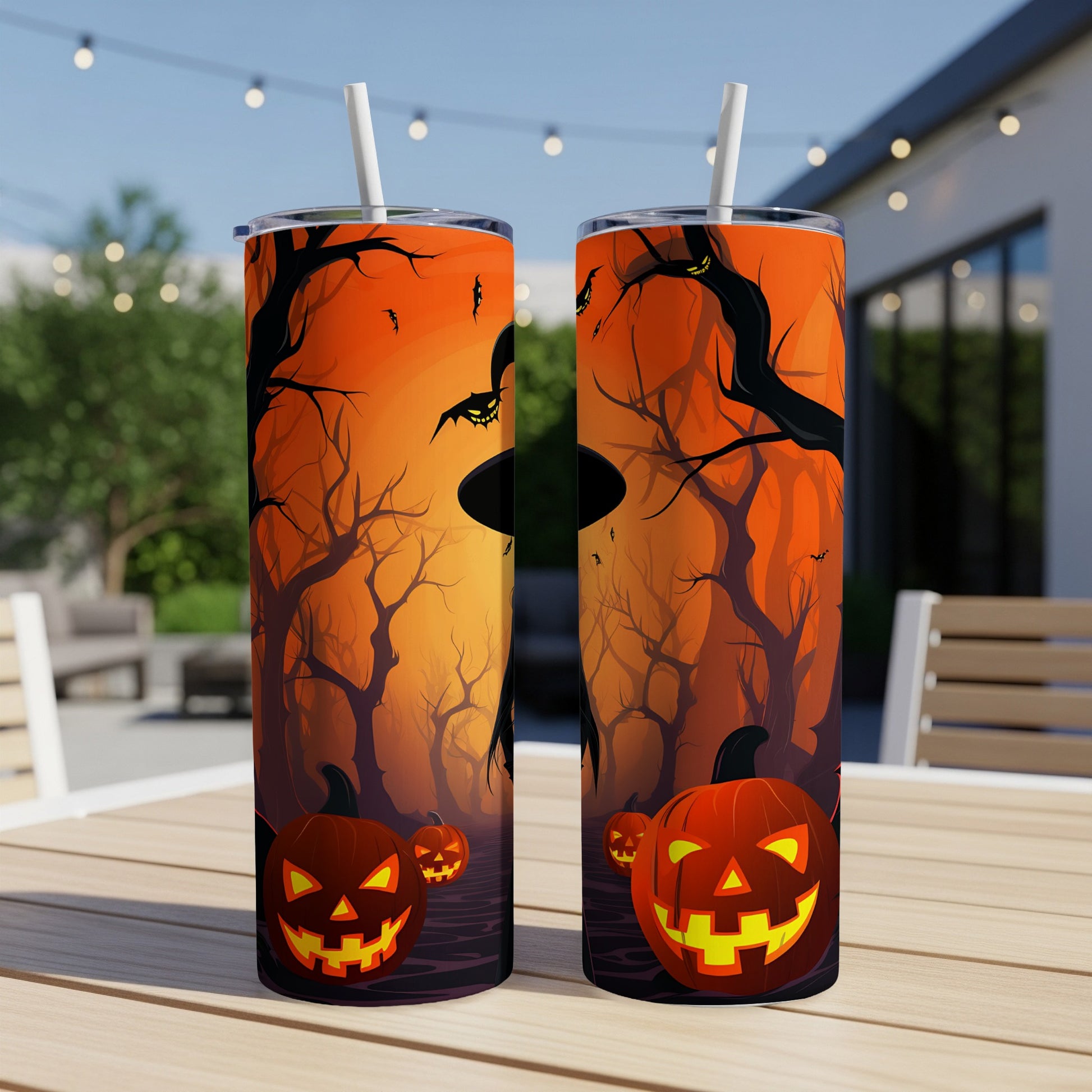 Two tumblers featuring Halloween pumpkins and spooky trees against an orange sunset.