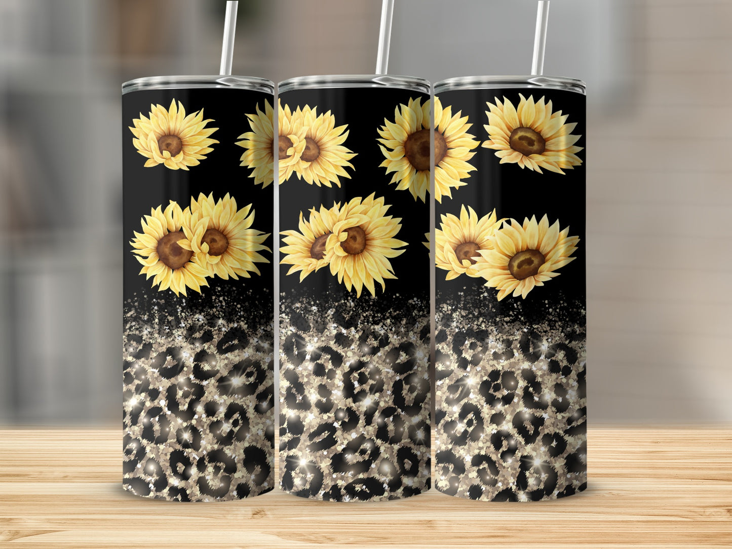 Three black tumblers with sunflowers and leopard print pattern.