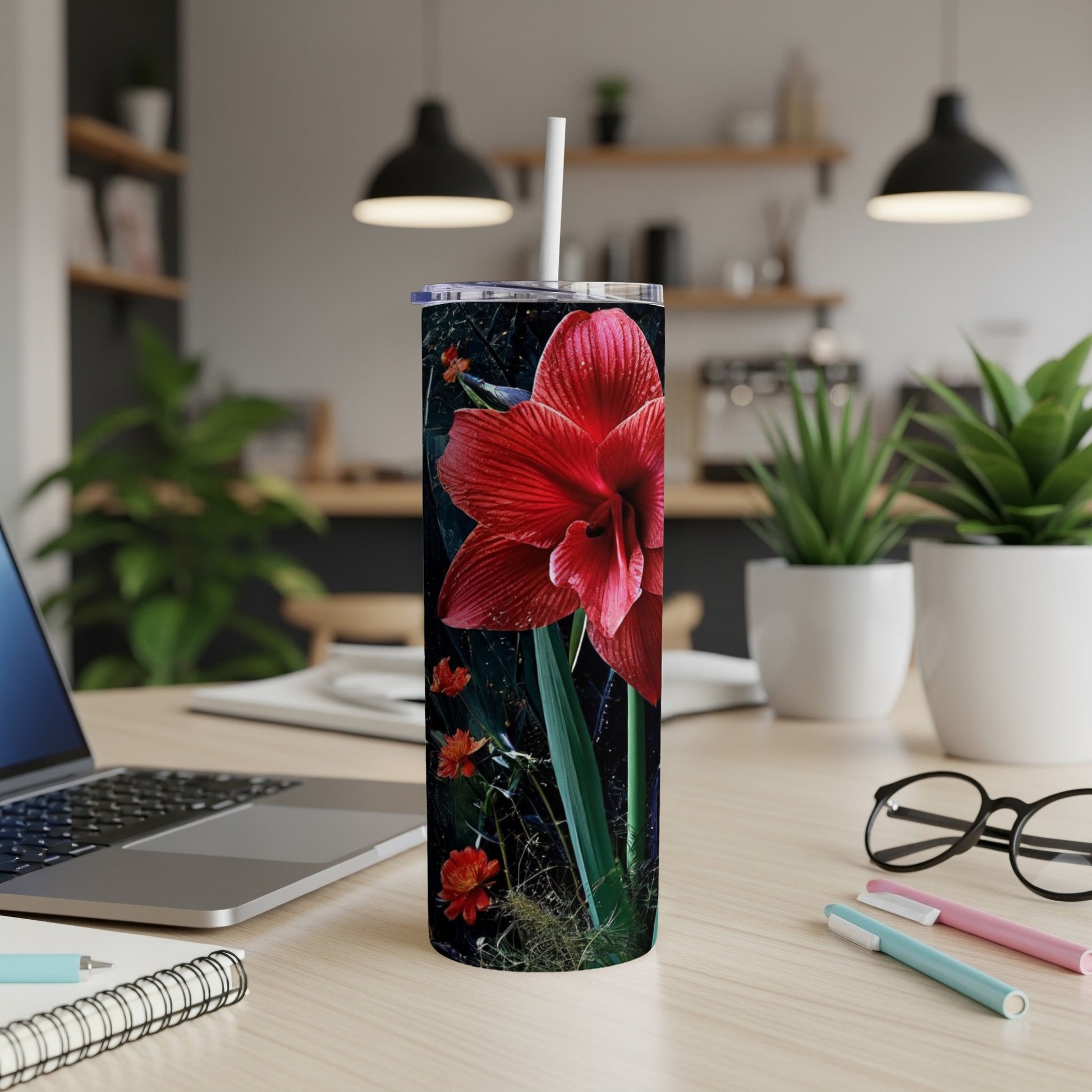 Red amaryllis flower with dark background on a tall tumbler.